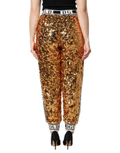 Load image into Gallery viewer, Dolce & Gabbana Metallic Gold DG Logo Sequined Jogger Pants