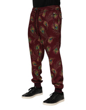 Load image into Gallery viewer, Dolce & Gabbana Burgundy Peacock Feather Print Jogger Pants