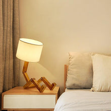 Load image into Gallery viewer, New Modern Luxury and Retro STEVVEX Wood Robot Shape Folding Table Lamp Creative European Fashion Bedroom Study Bedroom Bedside Linen Lamp Shade Table Lamp