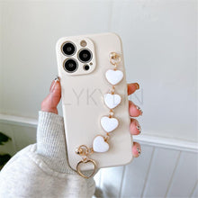 Load image into Gallery viewer, Soft Silicone Love Heart Chain Luxury Soft Flexible with Love Heart Chain Bracelet Hand Strap Girly Women Protective Cover for iPhone Wrist Bracelet Phone Case For iPhone 12 13 14 Pro Max Mini 11 Pro Max X XS Max XR 7 8 Plus