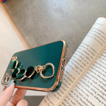 Load image into Gallery viewer, Luxury Women Silicone Phone Case Cover With Wrist Chain Bracelet for iPhone Wristband Bracelet Hand Holder Cover for iPhone 13 12 11 Pro Max plating Case Heart Chain Cases for iPhone 7 8 Plus XR XS Max X