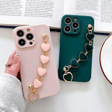 Load image into Gallery viewer, Soft Silicone Love Heart Chain Luxury Soft Flexible with Love Heart Chain Bracelet Hand Strap Girly Women Protective Cover for iPhone Wrist Bracelet Phone Case For iPhone 12 13 14 Pro Max Mini 11 Pro Max X XS Max XR 7 8 Plus