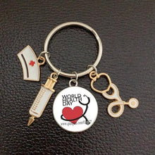 Load image into Gallery viewer, Creative Doctor Keychain Unique Personality Syringe Stethoscope Pendant Keychain Cartoon Colorful Handbag Pendant Keychain Doctor Injection Stethoscope Picture Keychain Round Dome Pendant Women Alloy Keychain