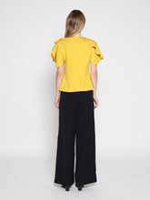 Load image into Gallery viewer, Ruffled neck & sleeve brooch detail solid top