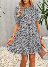 Load image into Gallery viewer, Floral smocked dress
