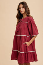 Load image into Gallery viewer, Tassel Contrast Trim Tie Neck Half Sleeve Tiered Dress – Bohemian-Inspired Dress with Tassel Details, Adjustable Tie Neck, and Tiered Design for a Flowing, Feminine Silhouette
