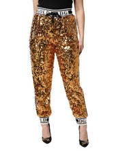 Load image into Gallery viewer, Dolce &amp; Gabbana Metallic Gold DG Logo Sequined Jogger Pants
