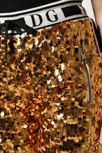 Load image into Gallery viewer, Dolce &amp; Gabbana Metallic Gold DG Logo Sequined Jogger Pants
