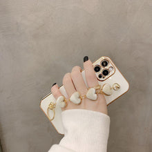 Load image into Gallery viewer, Luxury Women Silicone Phone Case Cover With Wrist Chain Bracelet for iPhone  Wristband Bracelet Hand Holder Cover for iPhone 13 12 11 Pro Max plating Case Heart Chain Cases for iPhone 7 8 Plus XR XS Max X
