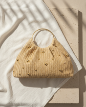 Load image into Gallery viewer, Artisanal Studded Handwoven Raffia Bag with Sculptural Gold Ring Handle
