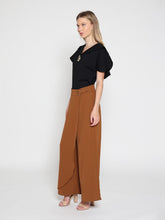 Load image into Gallery viewer, Ruffled neck &amp; sleeve brooch detail solid top

