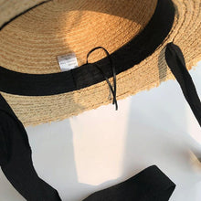 Load image into Gallery viewer, Vintage Straw Hat Women Wide Sun Protection Beach Hat Black And White Ribbon Bowknot Cute Design Straw Cap Women Elegant Summer Hat Beach Fedoras Casual Ladies Flat Top Hat

